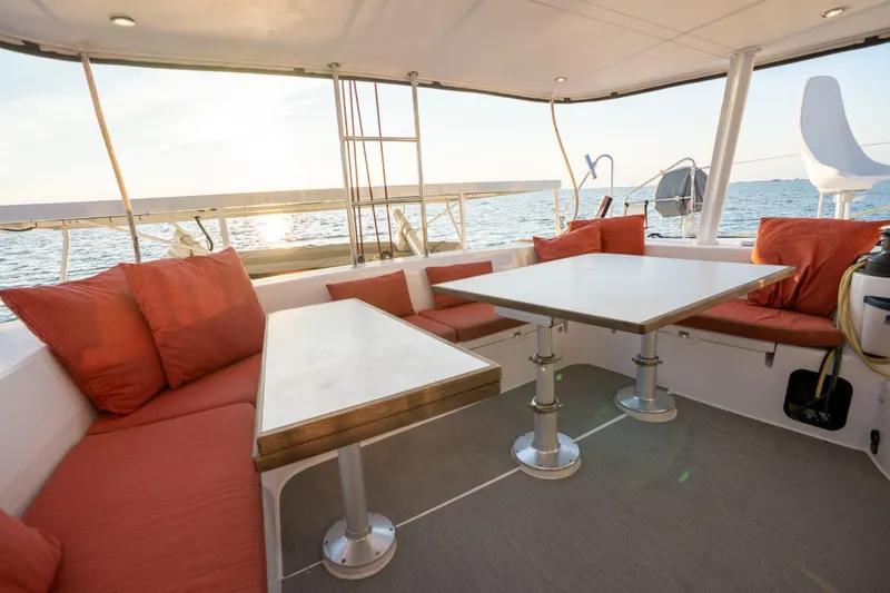 Rima Yacht Photos Pics Spacious 2018 Outremer 51 yacht deck with red cushions and ocean view.