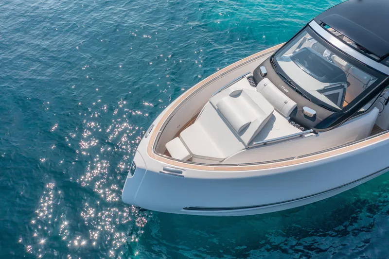  Yacht Photos Pics Invictus TT420 2025 yacht on sparkling blue water, showcasing sleek design and luxury.