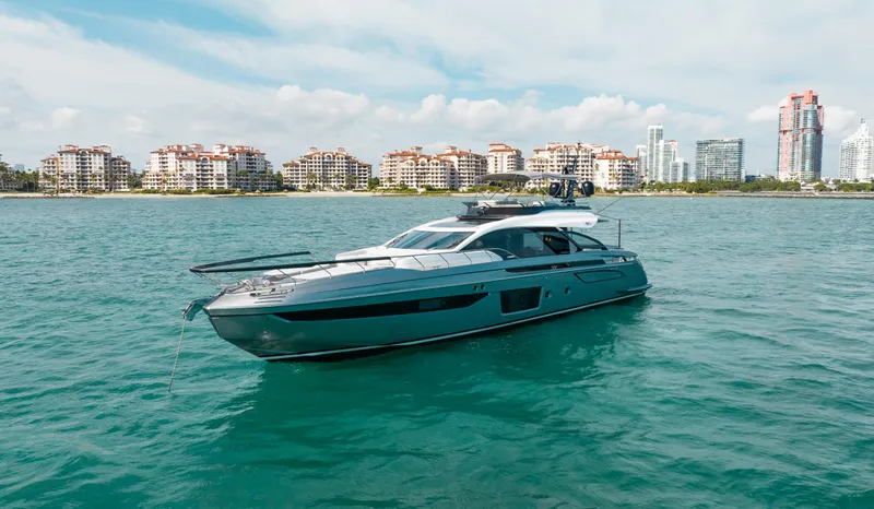  Yacht Photos Pics 2022 Azimut S8 yacht cruising near coastal city skyline.