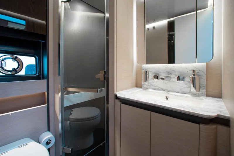  Yacht Photos Pics Luxurious bathroom in 2022 Azimut S8 yacht with modern fixtures and elegant design.