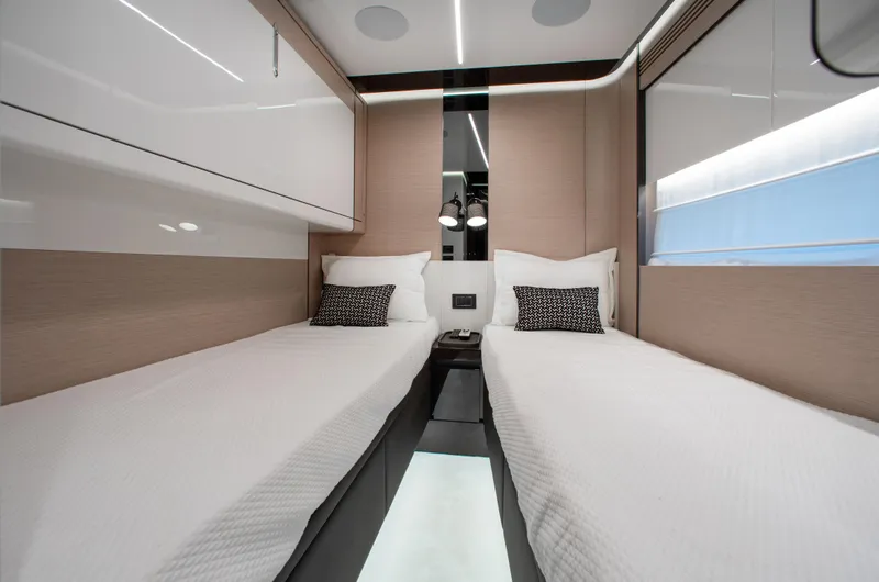  Yacht Photos Pics Luxurious twin cabin interior of 2022 Azimut S8 yacht, featuring modern design and elegant bedding.