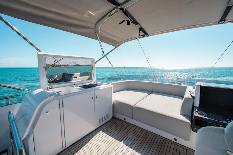  Yacht Photos Pics Luxurious 2022 Azimut S8 yacht deck with seating, ocean view, and modern amenities.