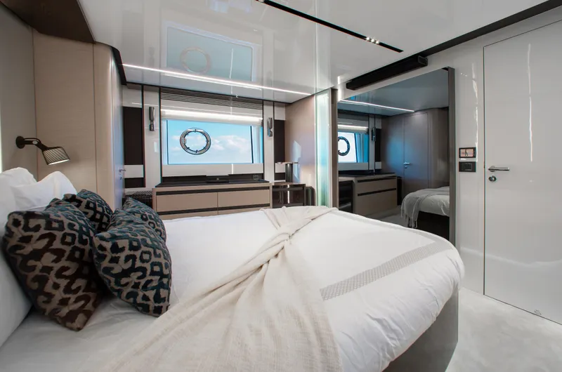  Yacht Photos Pics Luxurious bedroom interior of 2022 Azimut S8 yacht with modern design and elegant decor.