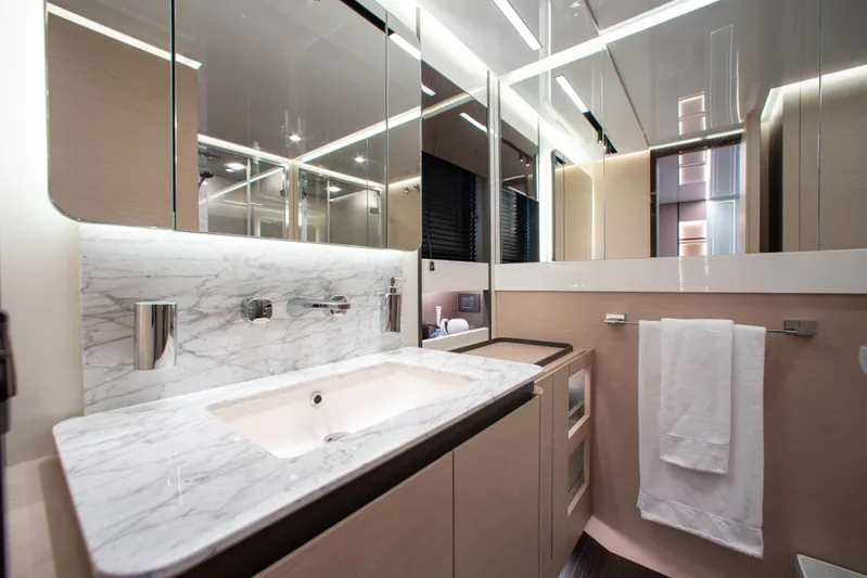  Yacht Photos Pics Luxurious bathroom in 2022 Azimut S8 yacht with marble countertop and modern fixtures.