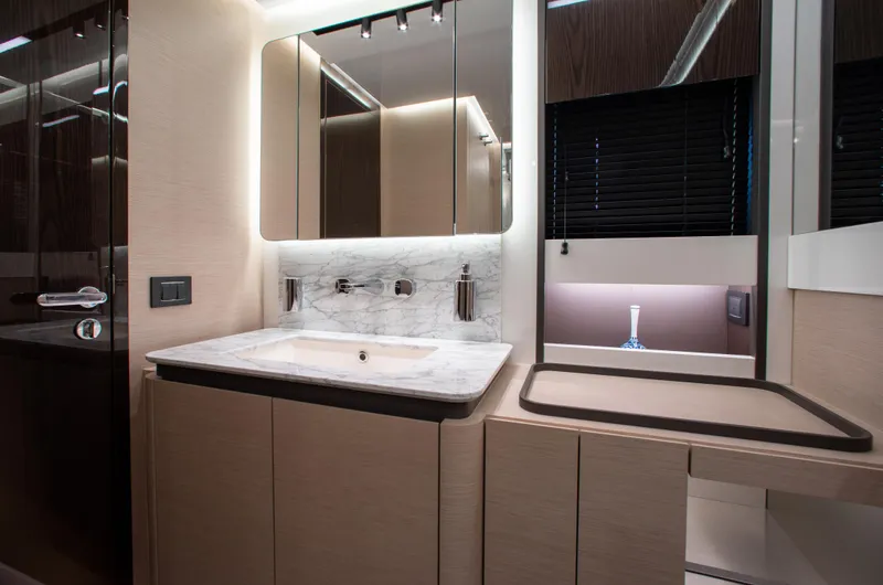  Yacht Photos Pics Luxurious bathroom interior of 2022 Azimut S8 yacht with modern fixtures and elegant design.