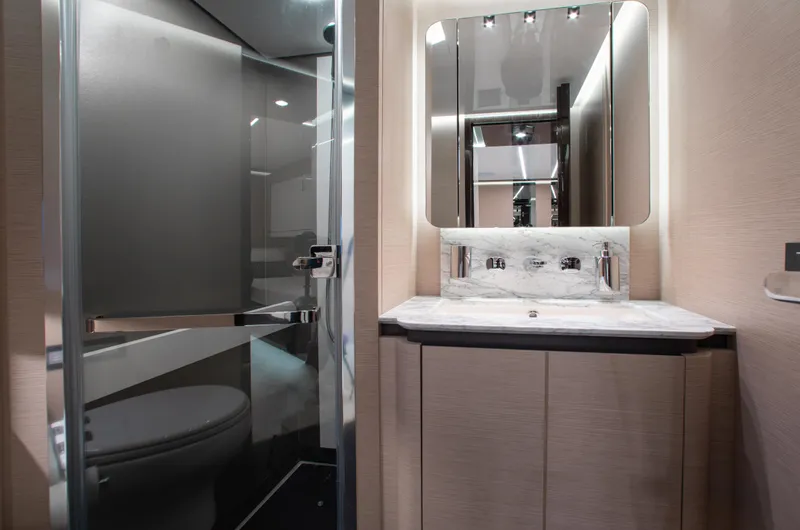  Yacht Photos Pics Luxurious bathroom interior of 2022 Azimut S8 yacht with modern fixtures and elegant design.
