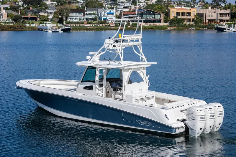 Vaquero Chingon Yacht Photos Pics 2016 Boston Whaler 370 Outrage boat on calm water, featuring triple 350 engines.