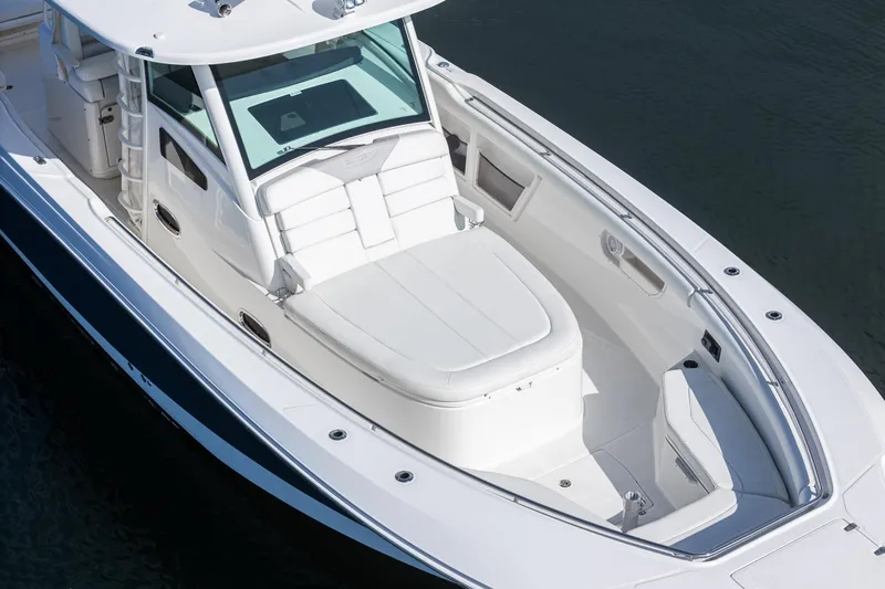 Vaquero Chingon Yacht Photos Pics 2016 Boston Whaler 370 Outrage boat with spacious seating and sleek design on water.