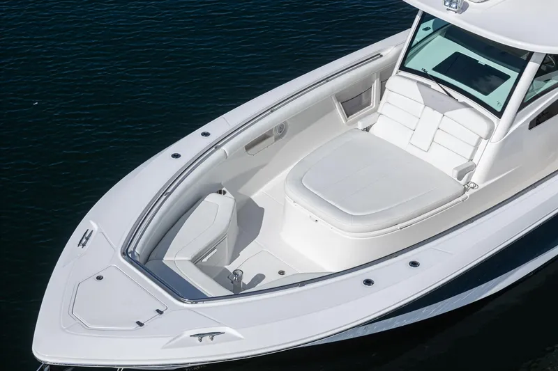 Vaquero Chingon Yacht Photos Pics 2016 Boston Whaler 370 Outrage boat, sleek design, spacious seating, on calm water.