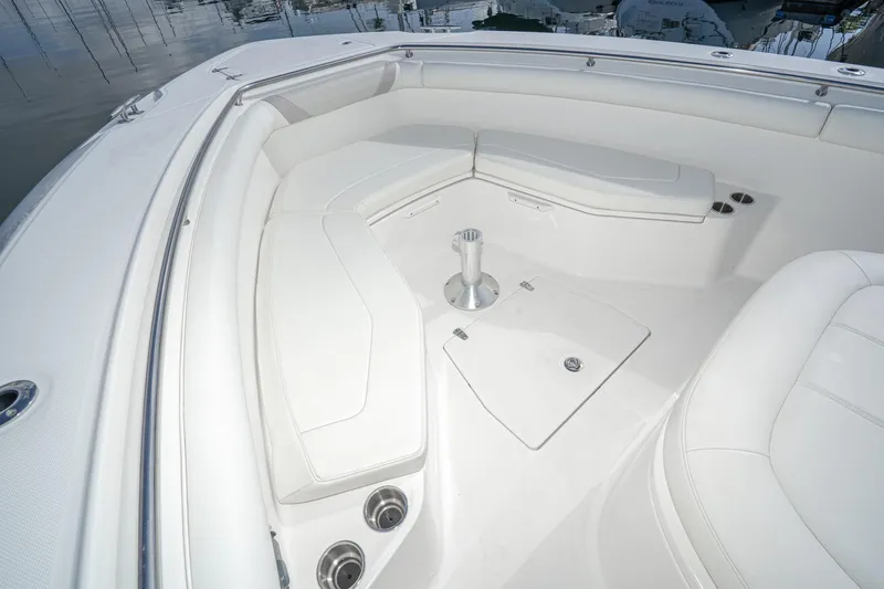 Vaquero Chingon Yacht Photos Pics 2016 Boston Whaler 370 Outrage boat interior with white cushioned seating.