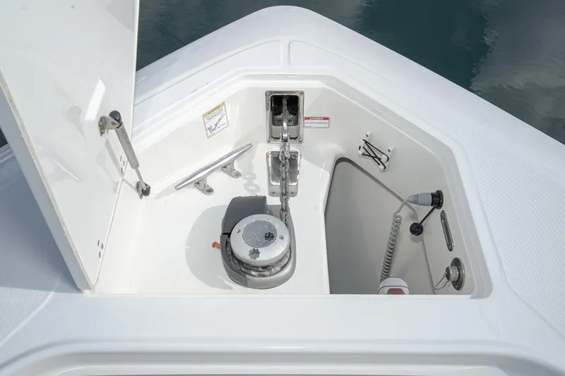 Vaquero Chingon Yacht Photos Pics 2016 Boston Whaler 370 Outrage anchor locker with winch and storage compartment.