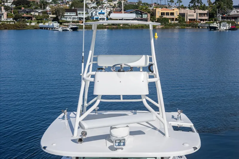 Vaquero Chingon Yacht Photos Pics 2016 Boston Whaler 370 Outrage boat on calm water with scenic background.