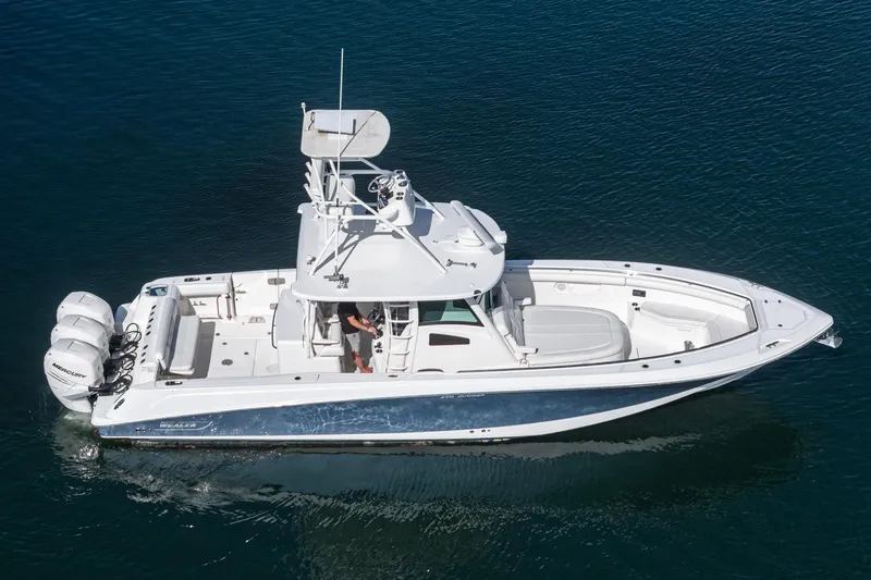 Vaquero Chingon Yacht Photos Pics 2016 Boston Whaler 370 Outrage boat cruising on clear blue water.