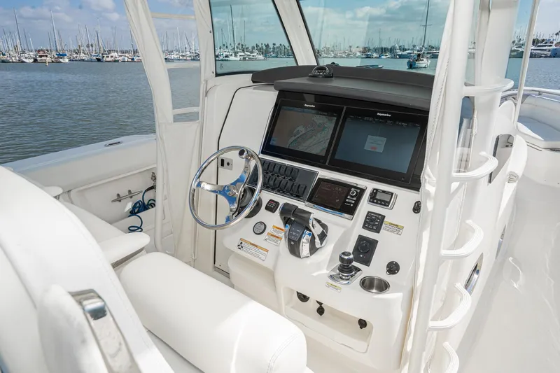 Vaquero Chingon Yacht Photos Pics 2016 Boston Whaler 370 Outrage helm with advanced navigation systems and luxurious seating.
