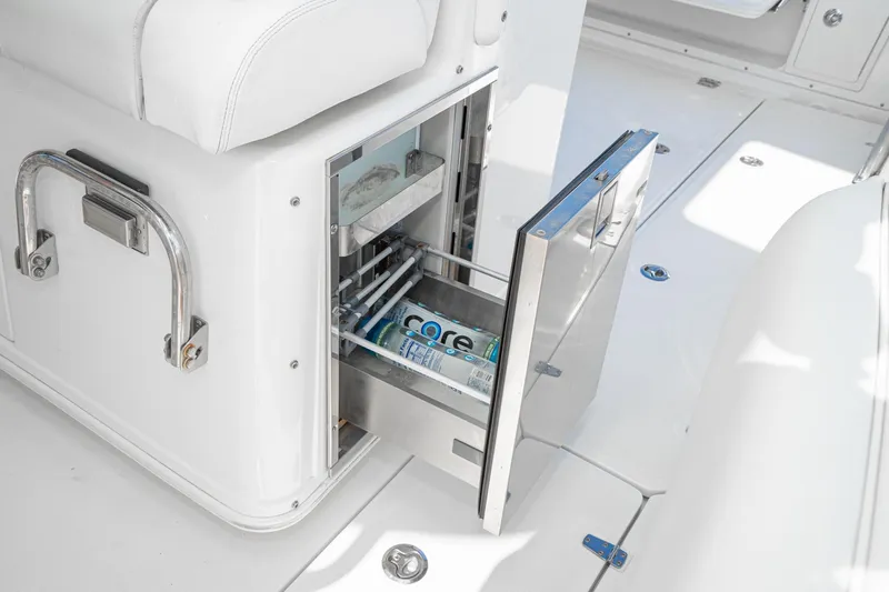 Vaquero Chingon Yacht Photos Pics 2016 Boston Whaler 370 Outrage boat with open storage compartment and beverage can.