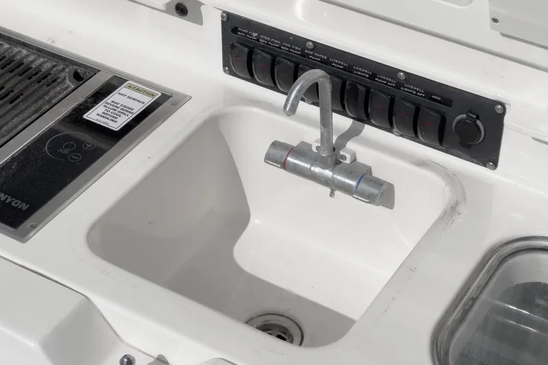 Vaquero Chingon Yacht Photos Pics 2016 Boston Whaler 370 Outrage sink and control panel detail.
