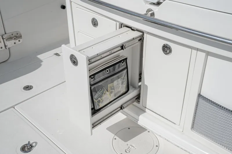 Vaquero Chingon Yacht Photos Pics 2016 Boston Whaler 370 Outrage boat storage compartment with open drawer.