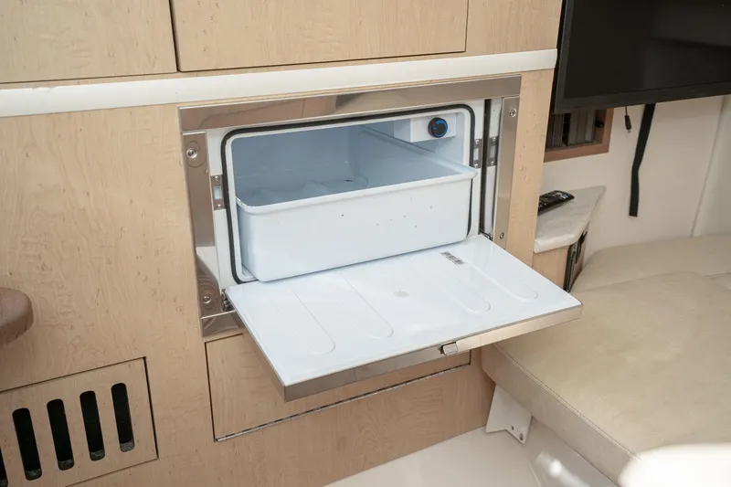 Vaquero Chingon Yacht Photos Pics 2016 Boston Whaler 370 Outrage interior with built-in storage compartment.