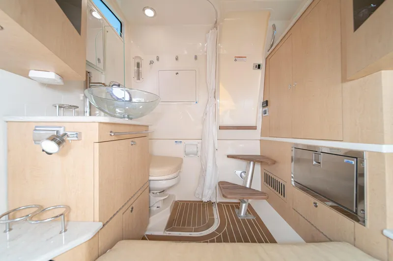 Vaquero Chingon Yacht Photos Pics 2016 Boston Whaler 370 Outrage interior with modern amenities and elegant wood finishes.