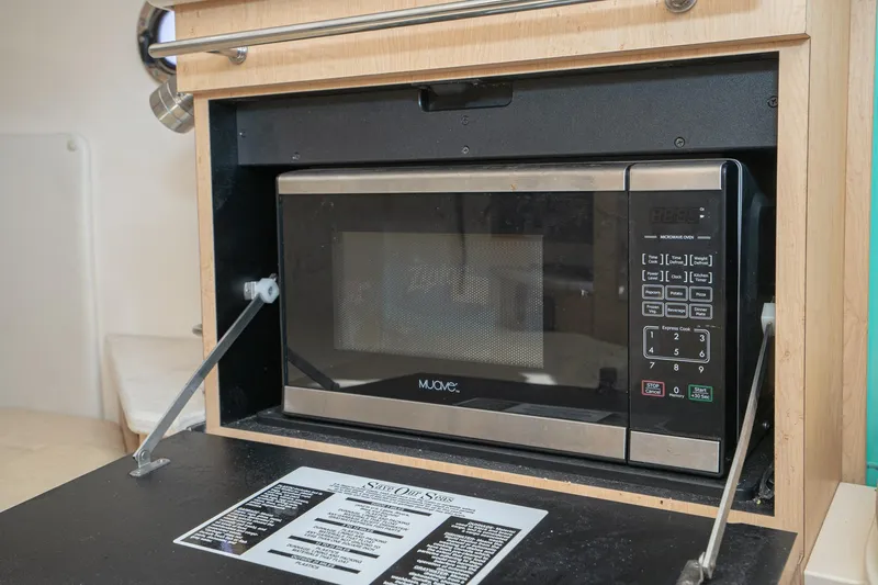 Vaquero Chingon Yacht Photos Pics Microwave oven inside 2016 Boston Whaler 370 Outrage boat kitchen area.