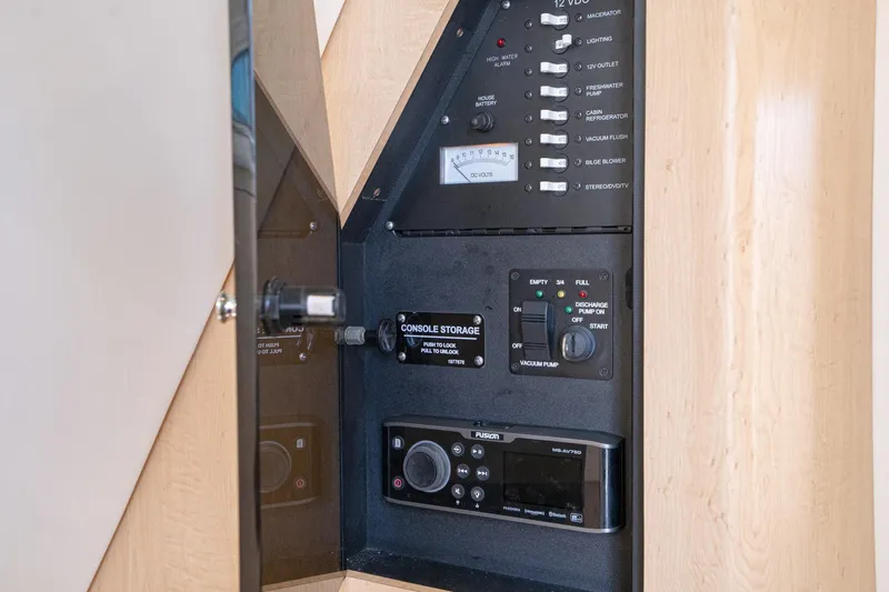 Vaquero Chingon Yacht Photos Pics Control panel of a 2016 Boston Whaler 370 Outrage boat, featuring various switches and gauges.