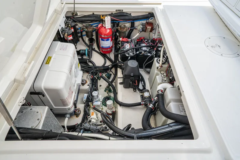 Vaquero Chingon Yacht Photos Pics Engine compartment of 2016 Boston Whaler 370 Outrage, showcasing wiring and components.