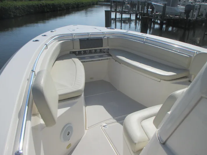  Yacht Photos Pics 2018 Cobia 301 Center Console boat interior with cushioned seating and sleek design.