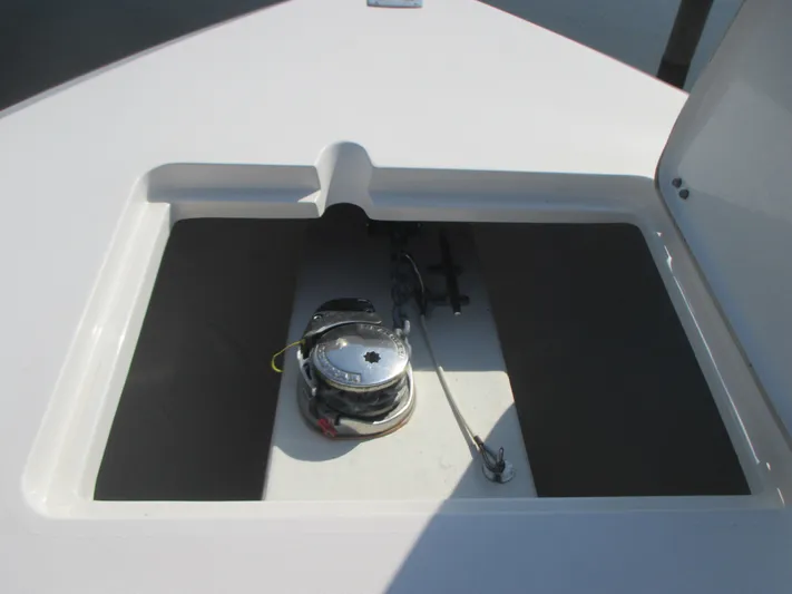  Yacht Photos Pics 2018 Cobia 301 Center Console anchor storage compartment with open hatch.