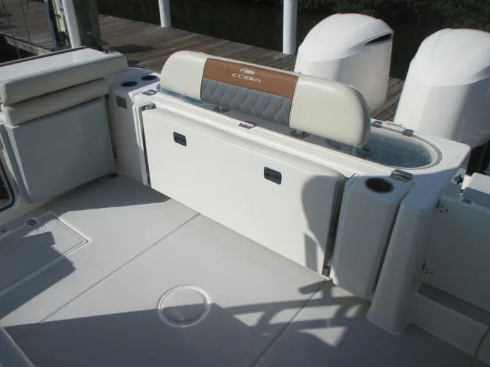  Yacht Photos Pics 2018 Cobia 301 Center Console boat interior with seating and storage.