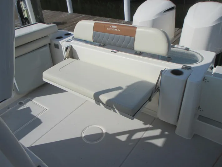  Yacht Photos Pics 2018 Cobia 301 Center Console boat with foldable seating and storage compartments.