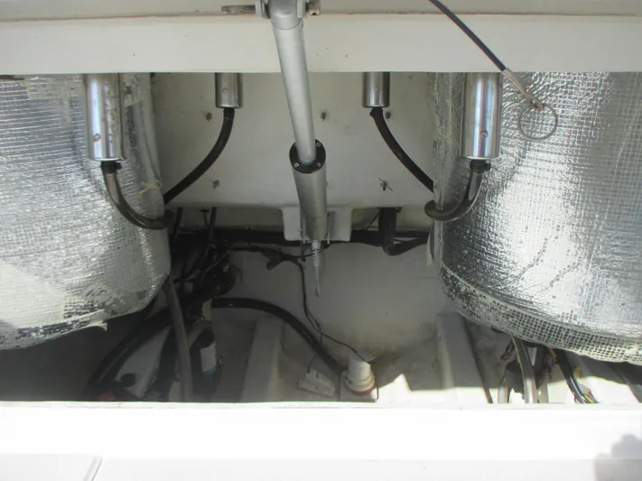  Yacht Photos Pics 2018 Cobia 301 Center Console engine compartment with hydraulic components and insulation.