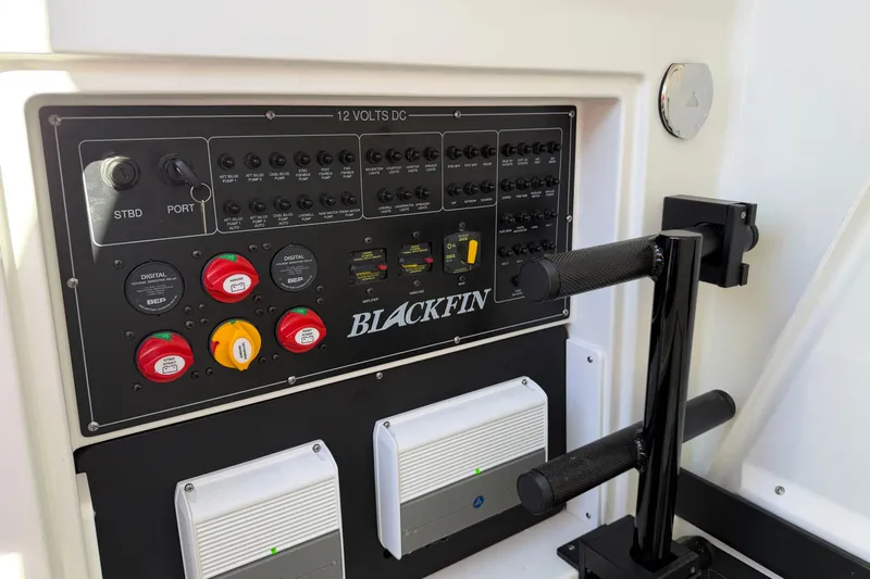  Yacht Photos Pics Control panel of 2023 Blackfin 302 CC boat with switches and indicators.