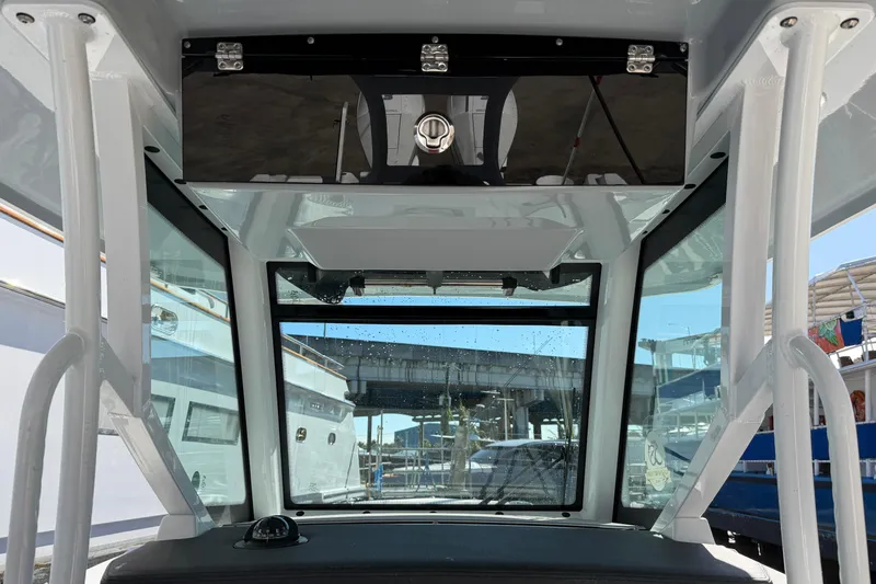  Yacht Photos Pics 2023 Blackfin 302 CC boat interior with windshield and storage compartment.