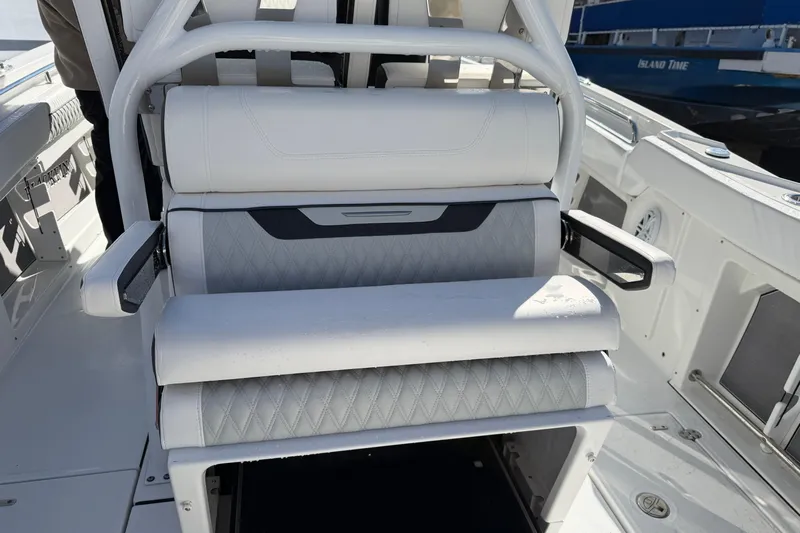  Yacht Photos Pics 2023 Blackfin 302 CC boat interior with white cushioned seating and armrests.