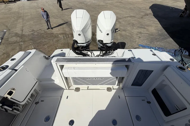  Yacht Photos Pics 2023 Blackfin 302 CC boat with dual Mercury engines on display.