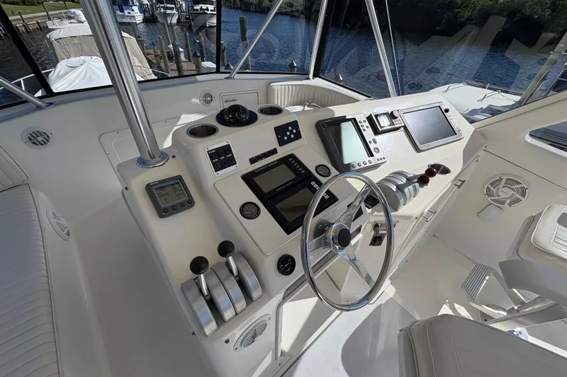 Fender Bender Yacht Photos Pics Cockpit of 1996 Ocean Yachts 48 Super Sport with navigation controls and steering wheel.