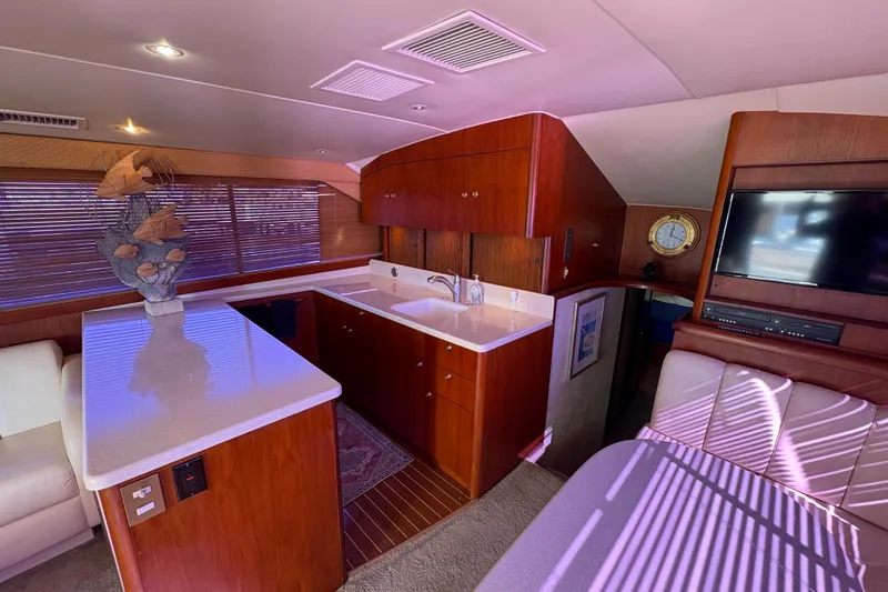 Fender Bender Yacht Photos Pics Luxurious interior of a 1996 Ocean Yachts 48 Super Sport with modern amenities.