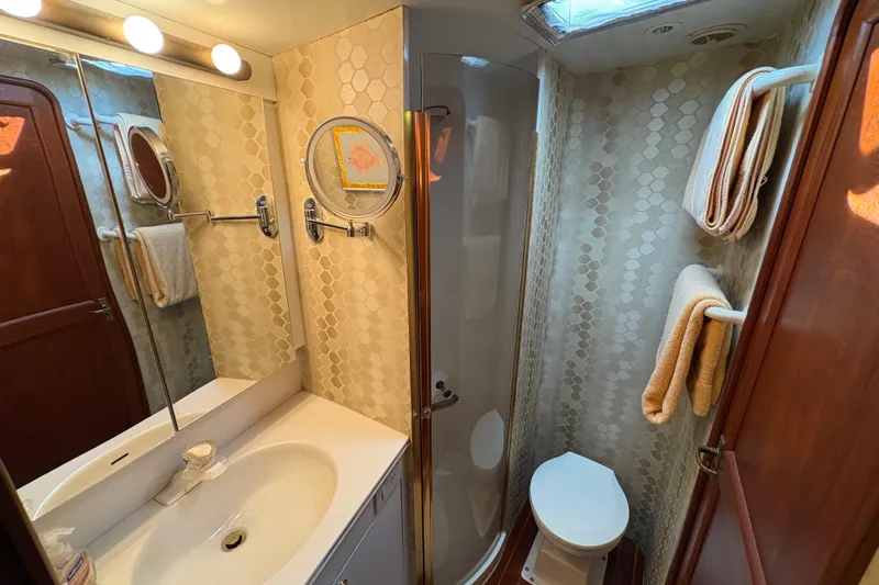 Fender Bender Yacht Photos Pics Bathroom interior of 1996 Ocean Yachts 48 Super Sport with shower and vanity.
