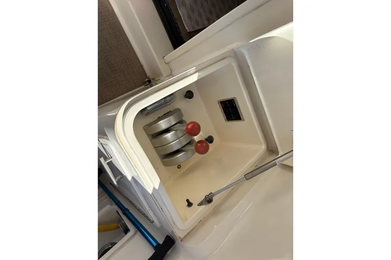 Fender Bender Yacht Photos Pics Compartment of 1996 Ocean Yachts 48 Super Sport with mechanical components visible.