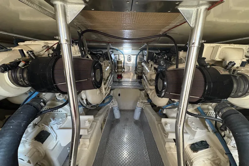 Fender Bender Yacht Photos Pics Engine room of 1996 Ocean Yachts 48 Super Sport, showcasing dual engines and mechanical components.