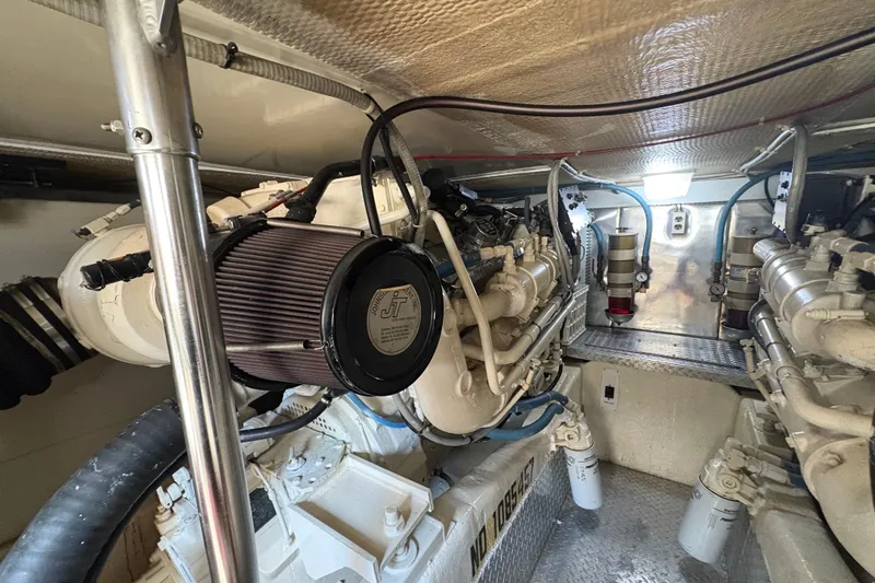 Fender Bender Yacht Photos Pics Engine room of a 1996 Ocean Yachts 48 Super Sport, showcasing mechanical components.
