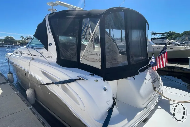 Irish Rover Yacht Photos Pics 2006 Sea Ray 360 Sundancer docked, featuring sleek design and American flag.