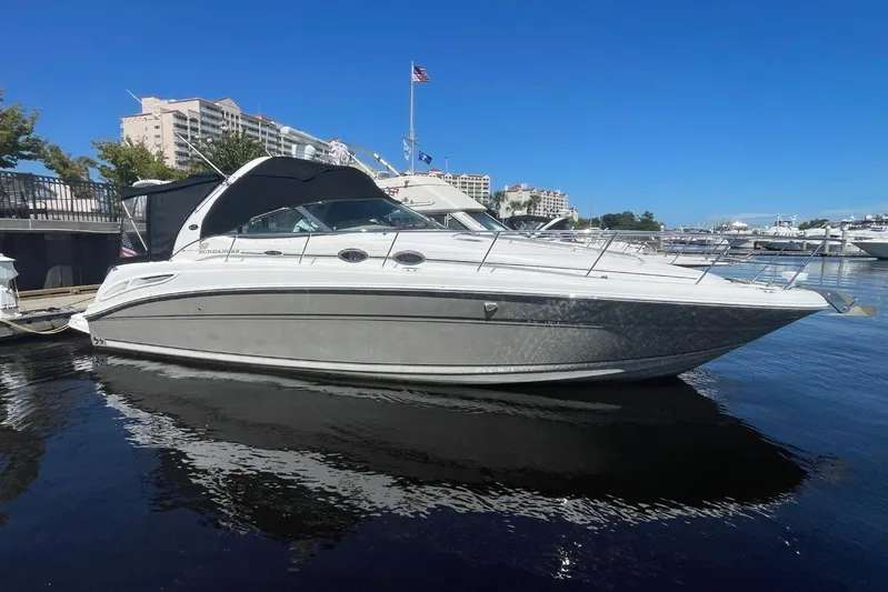 Irish Rover Yacht Photos Pics 2006 Sea Ray 360 Sundancer yacht docked in a marina under clear blue skies.