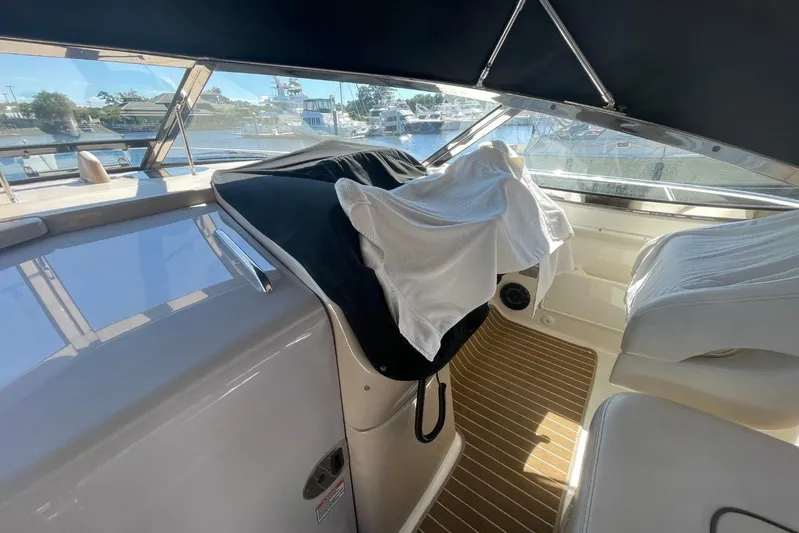 Irish Rover Yacht Photos Pics Interior view of 2006 Sea Ray 360 Sundancer yacht with covered dashboard and seating.