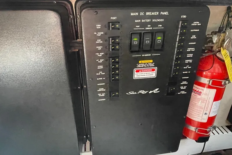 Irish Rover Yacht Photos Pics Main DC breaker panel on 2006 Sea Ray 360 Sundancer boat with fire extinguisher nearby.