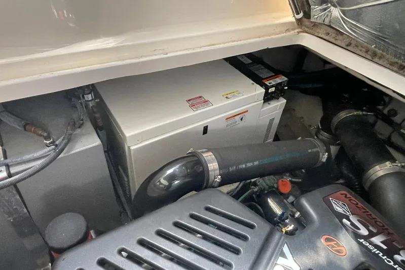 Irish Rover Yacht Photos Pics Engine compartment of a 2006 Sea Ray 360 Sundancer boat, showcasing mechanical components.