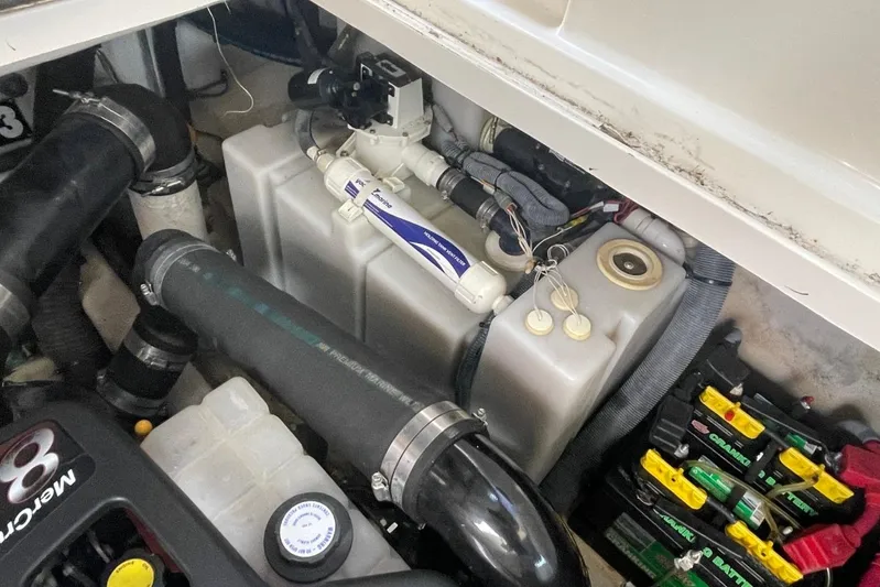 Irish Rover Yacht Photos Pics Engine compartment of a 2006 Sea Ray 360 Sundancer with visible components and batteries.