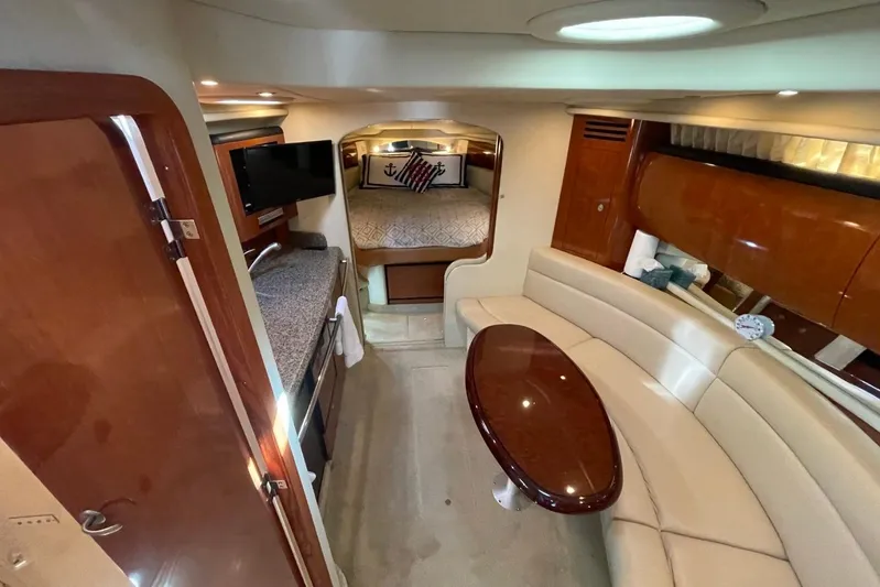 Irish Rover Yacht Photos Pics Luxurious interior of 2006 Sea Ray 360 Sundancer yacht with seating and sleeping area.