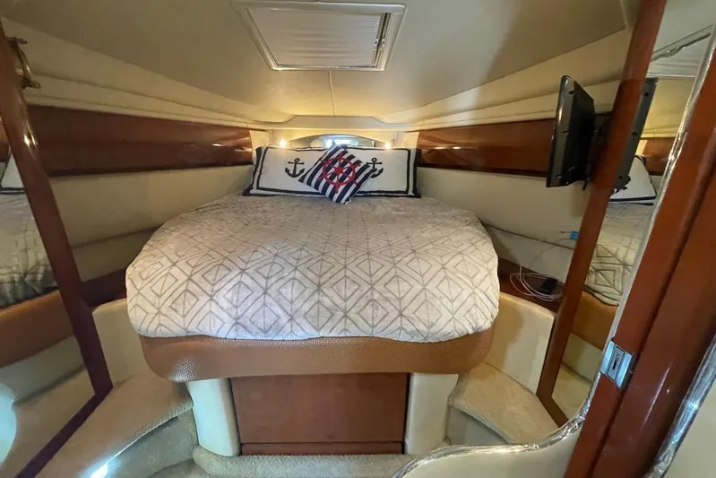 Irish Rover Yacht Photos Pics Luxurious cabin interior of 2006 Sea Ray 360 Sundancer yacht with cozy bedding.