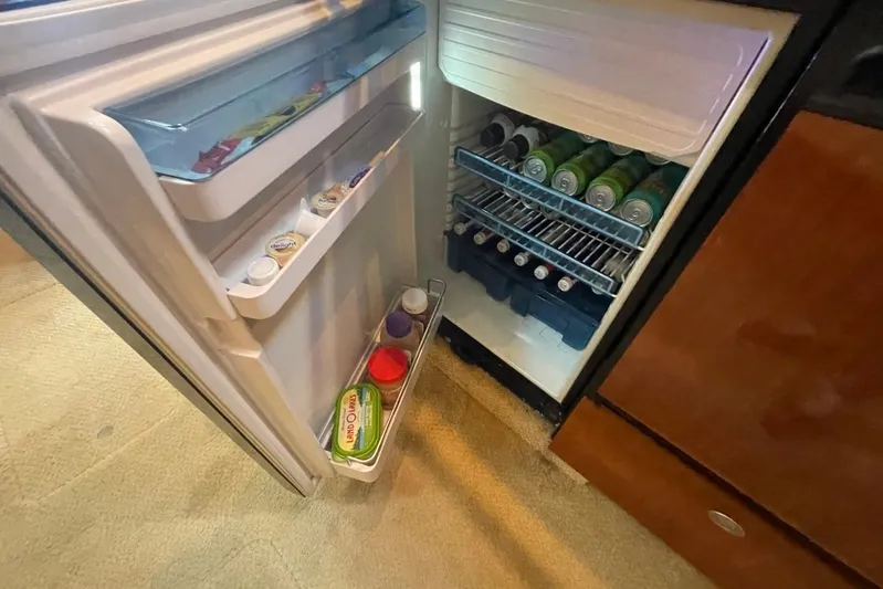 Irish Rover Yacht Photos Pics Open fridge on 2006 Sea Ray 360 Sundancer, stocked with drinks and condiments.